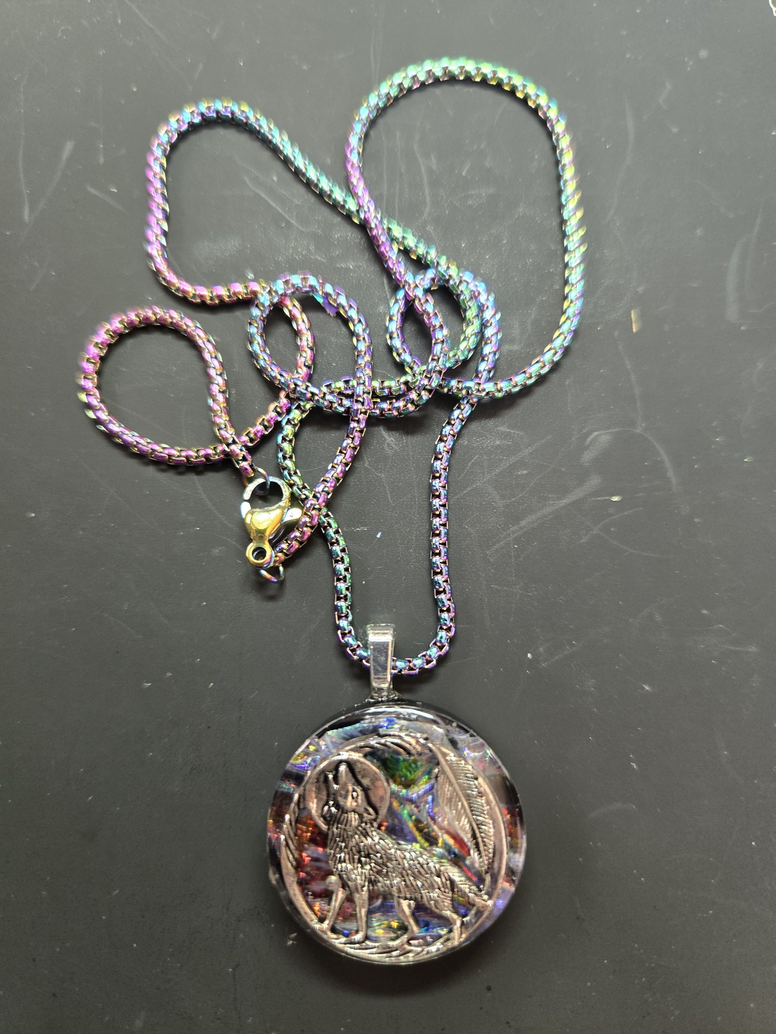 Full view of the howling wolf holographic resin pendant on its rainbow iridescent chain