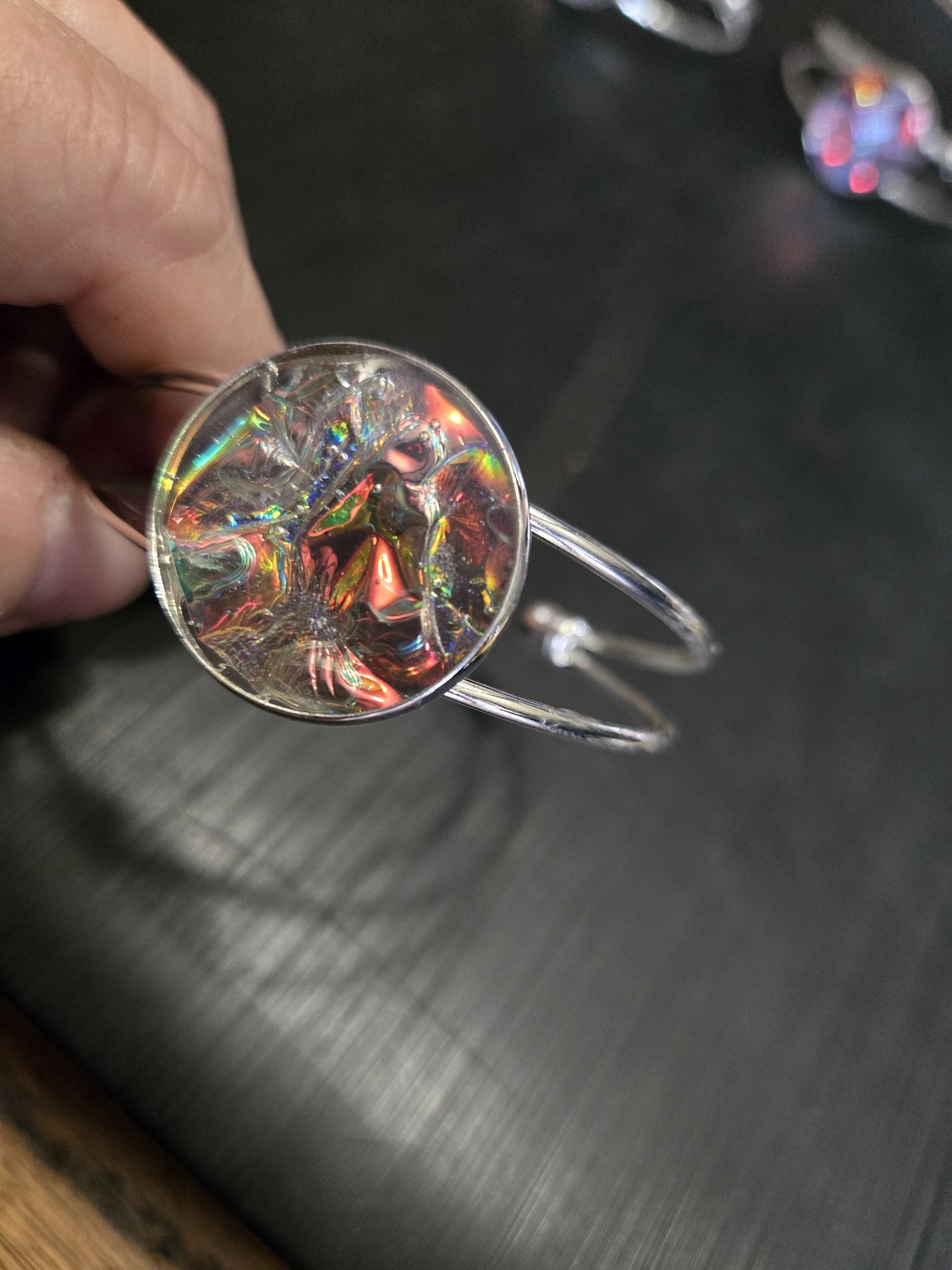 Second alternate view of the plain holographic resin medallion and adjustable cuff bracelet
