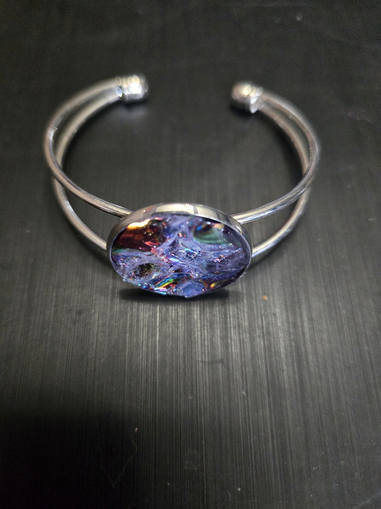 Second alternate angle of stock 143 plain holographic resin medallion and adjustable cuff bracelet