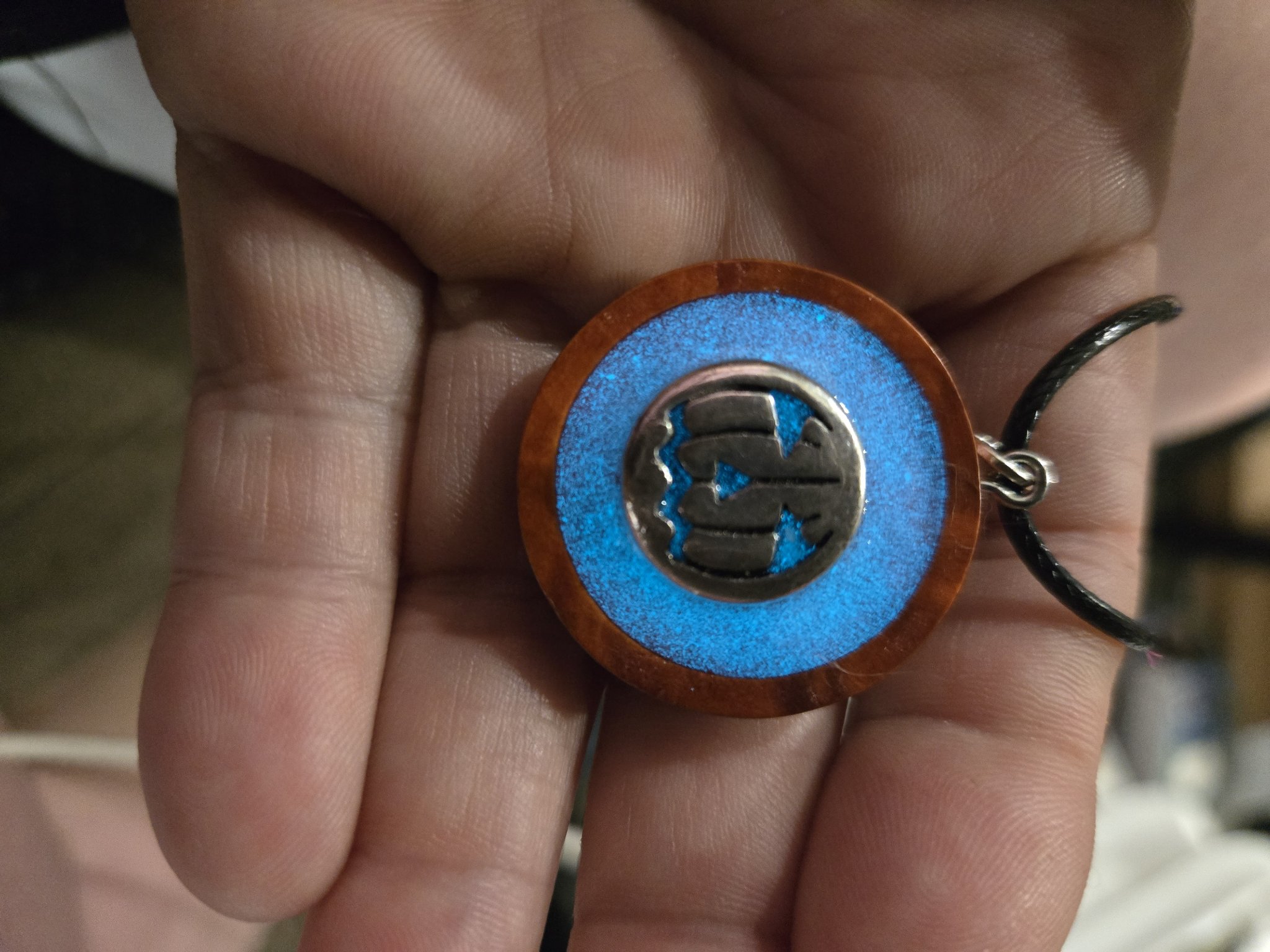 Stock 166 pumpkin pendant glowing bright blue in the dark