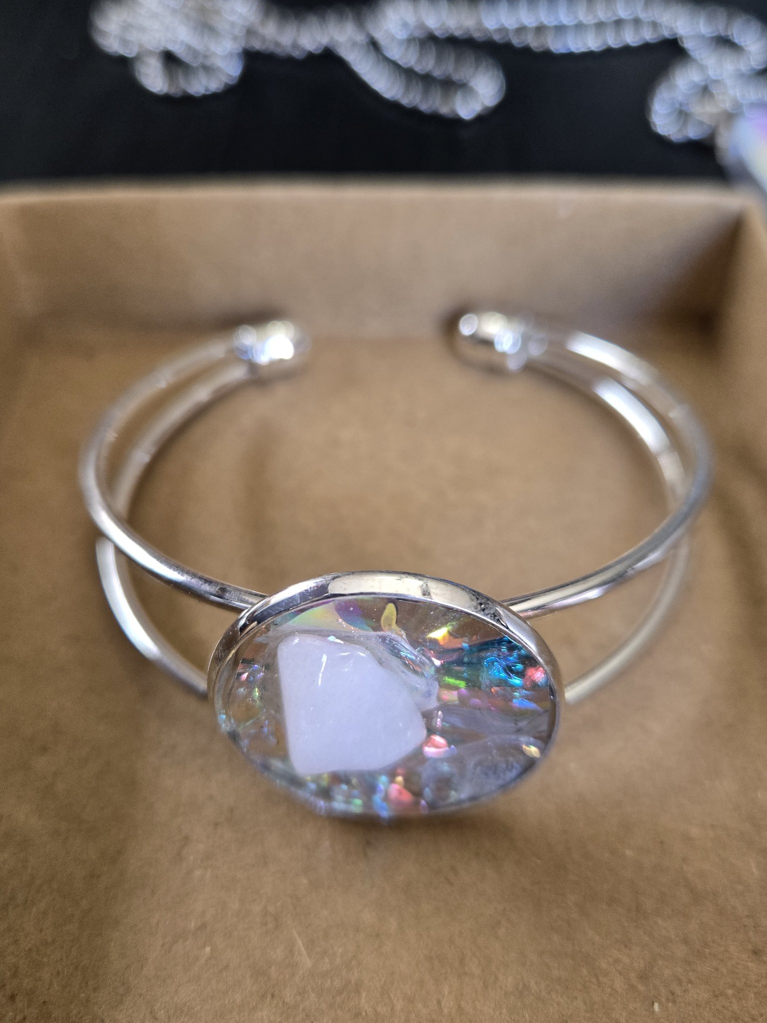 Stock 184 adjustable holographic quartz cuff bracelet presented in a gift box