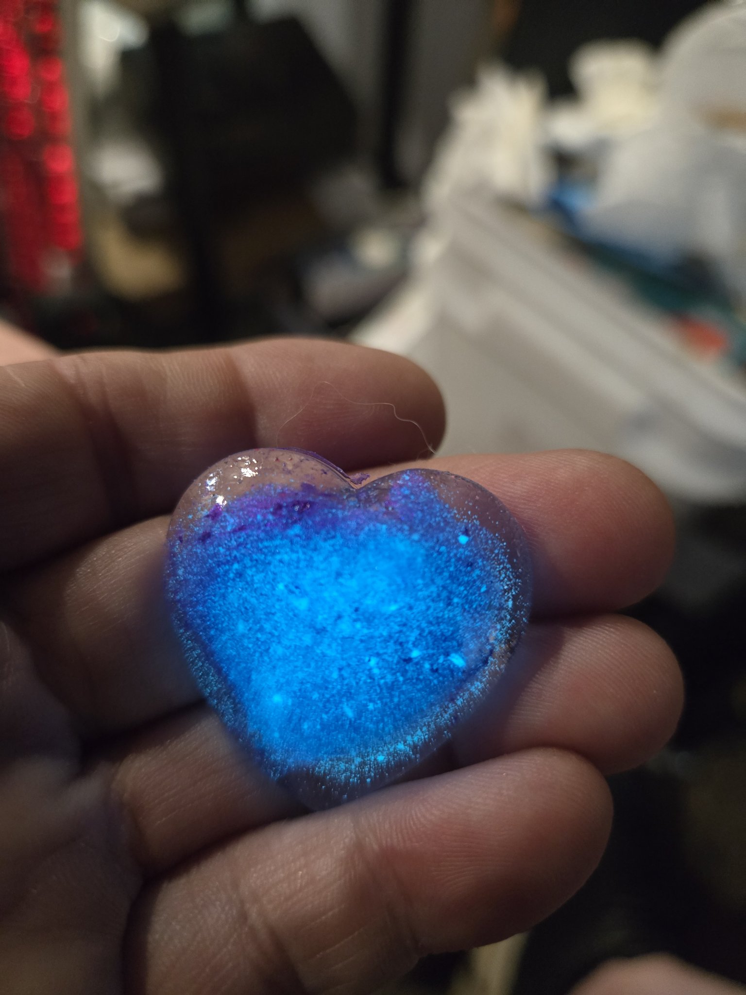 Stock 197 heart-shaped resin pendant glowing blue in the dark