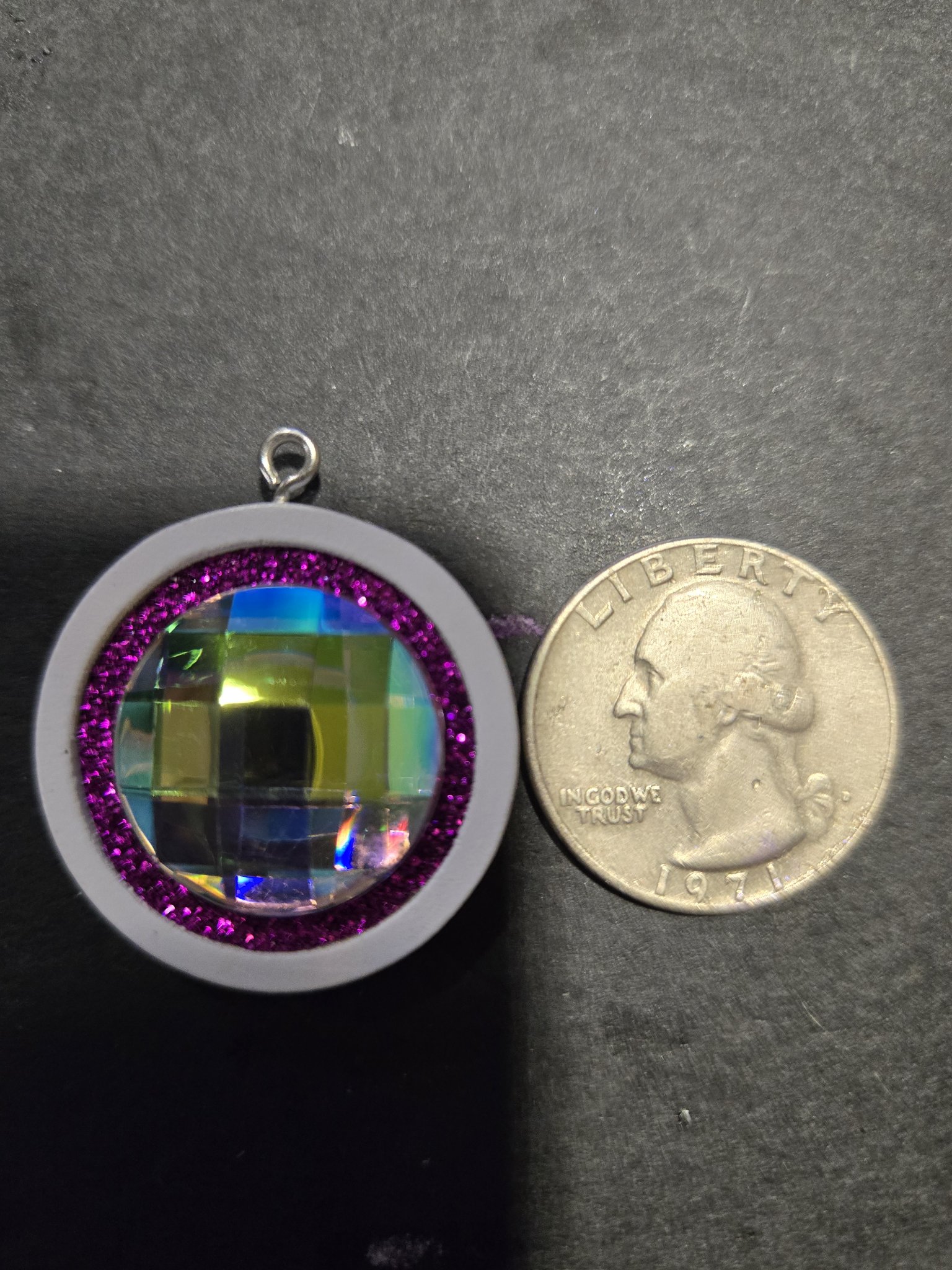Front of stock 208 disco ball pendant beside a quarter for scale
