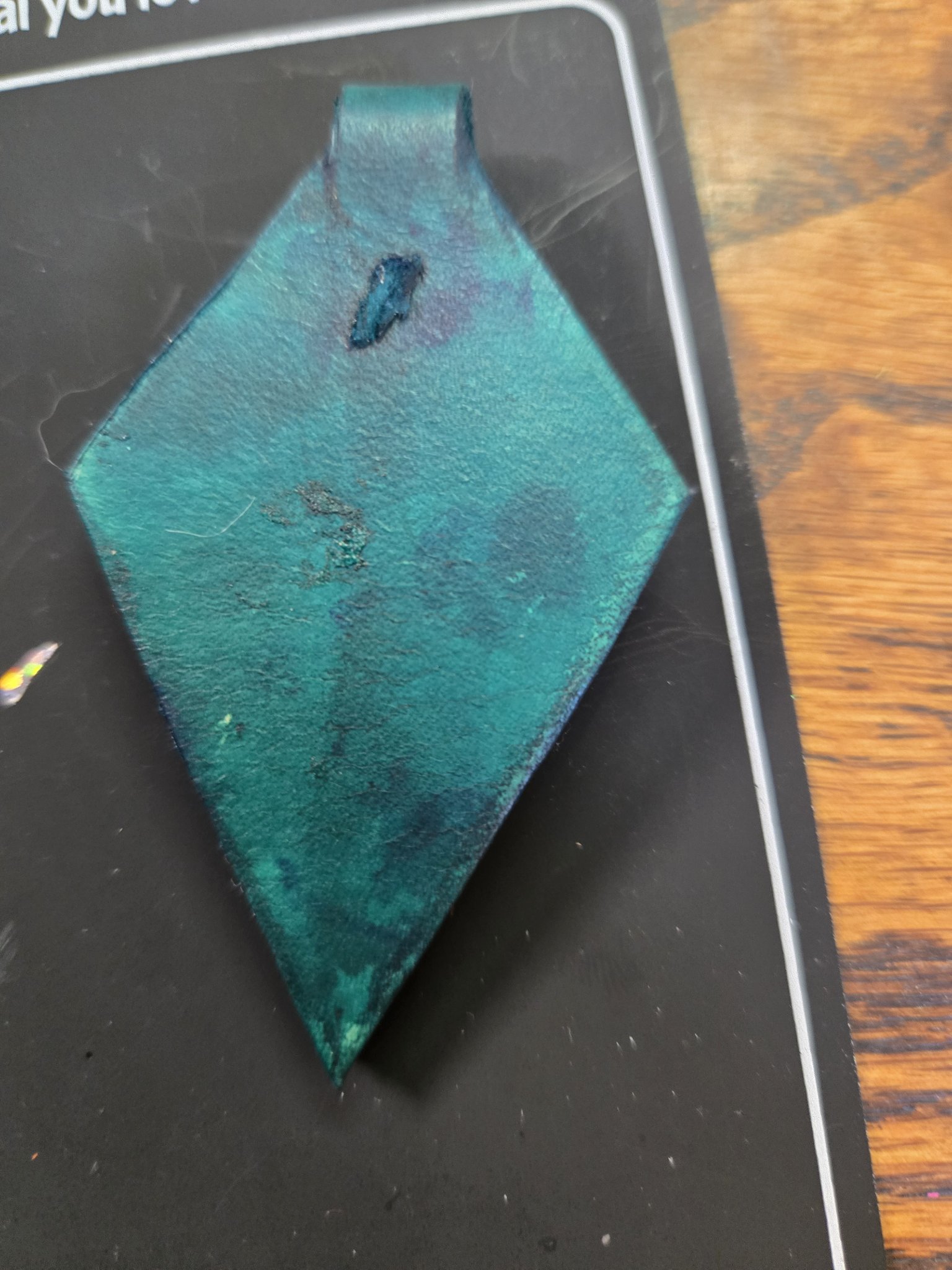 Back of the handmade leather dragon eye pendant
