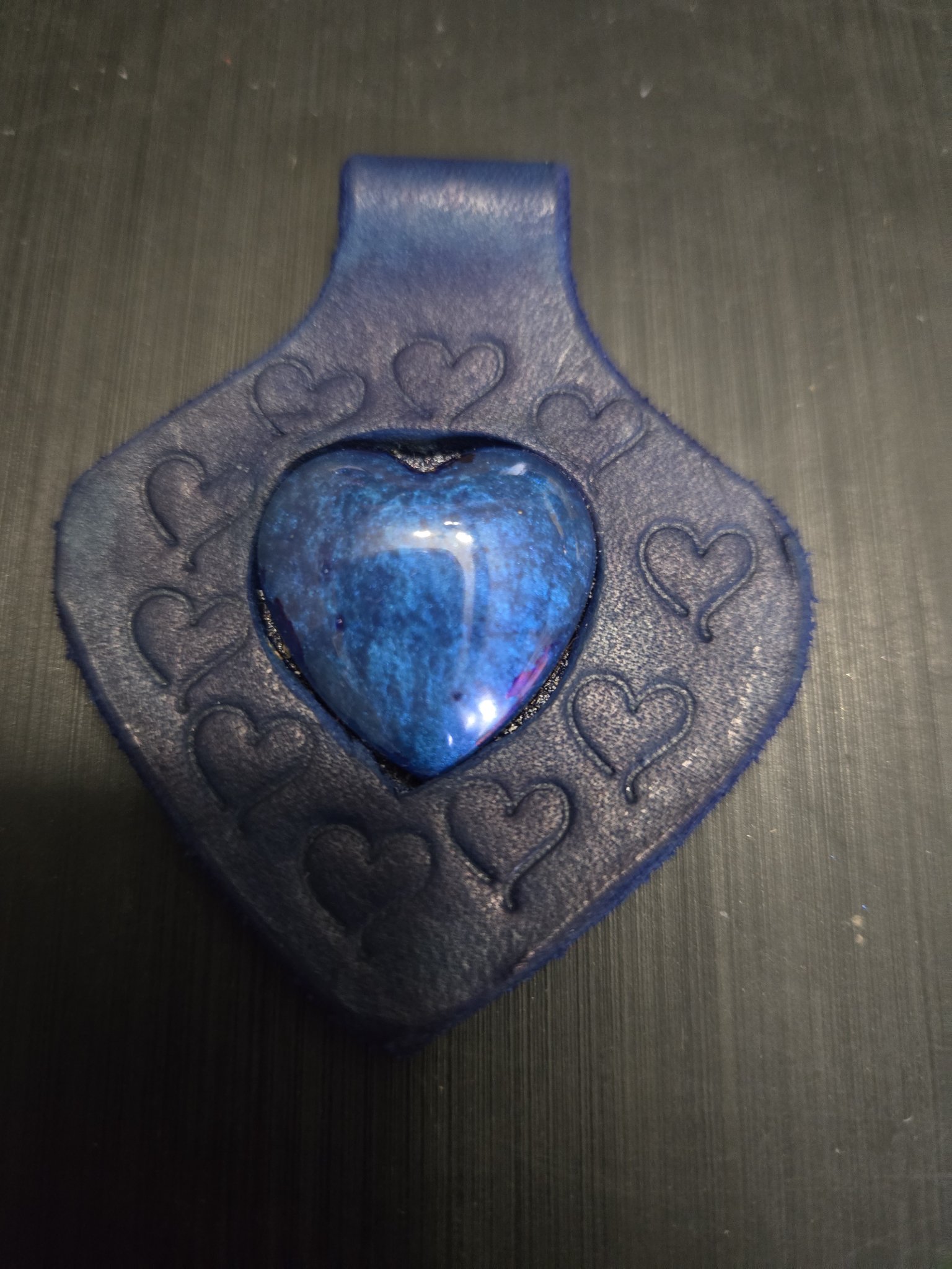 Close-up of stock 149 showing the blue heart stone and hand-stamped heart designs