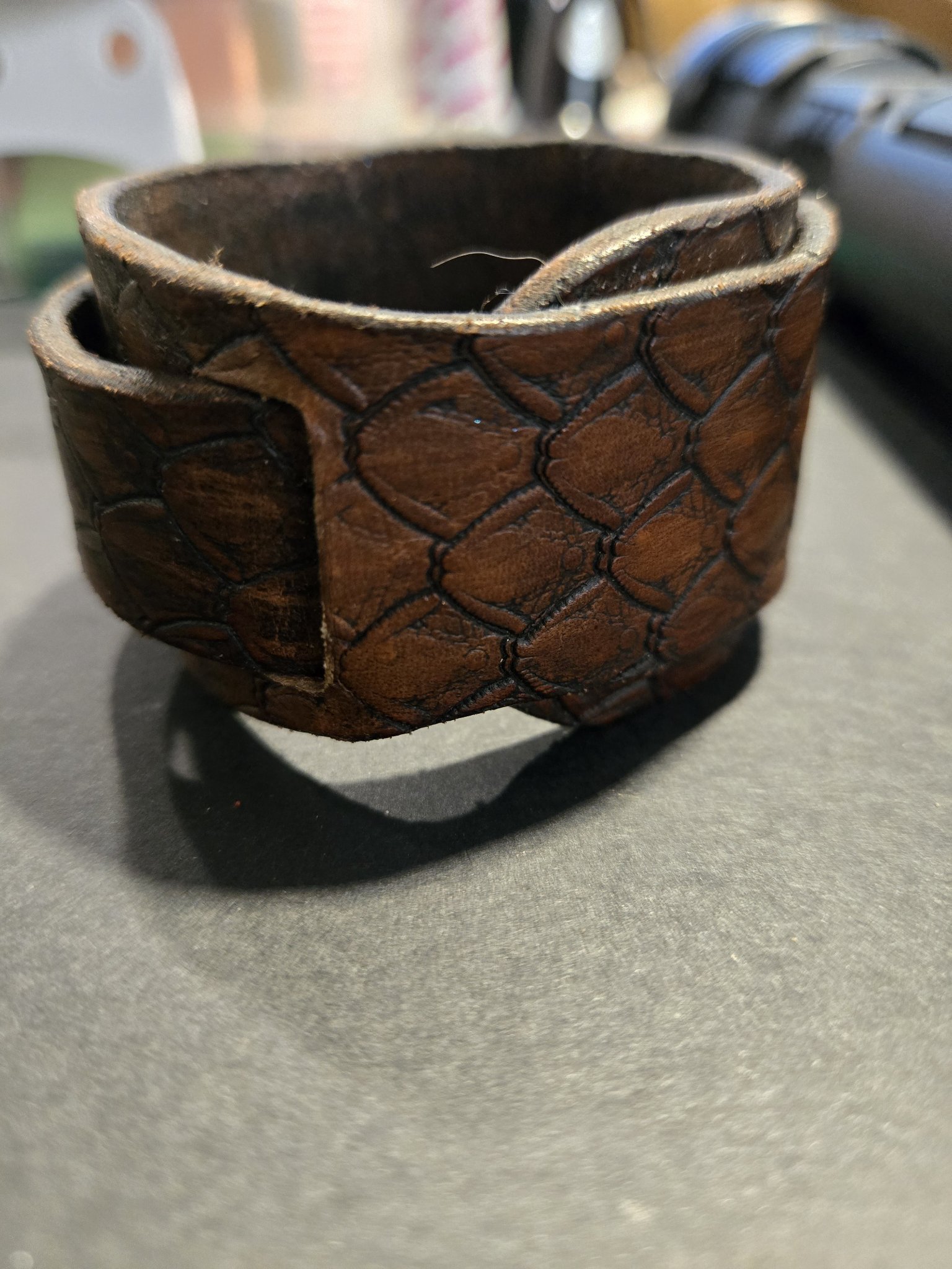 Stock 214 standing upright to show the full dragon scale stamping and cuff shape