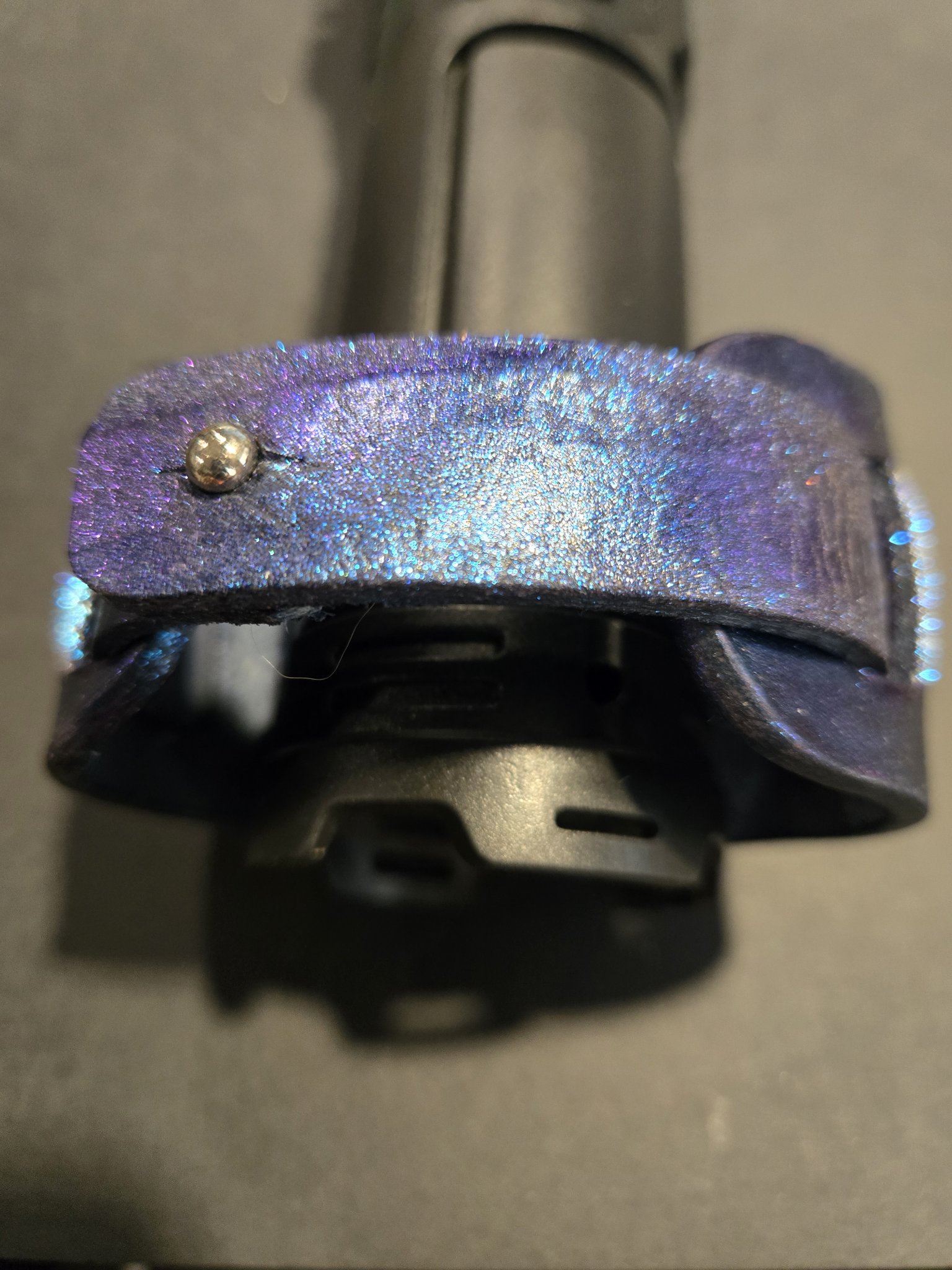 Back view of stock 216 showing its fixed button closure