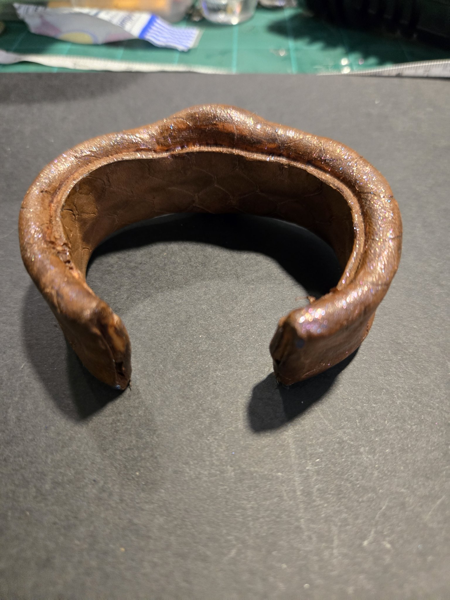 Open back view of stock 218 showing its adjustable bendable cuff shape
