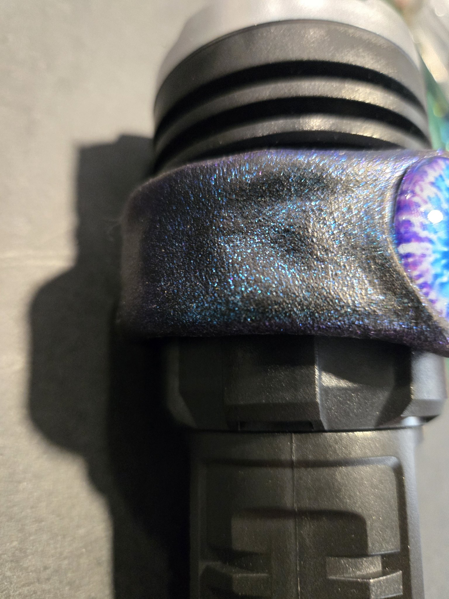Close-up of the left side of stock 219 showing blue sparkle across the leather