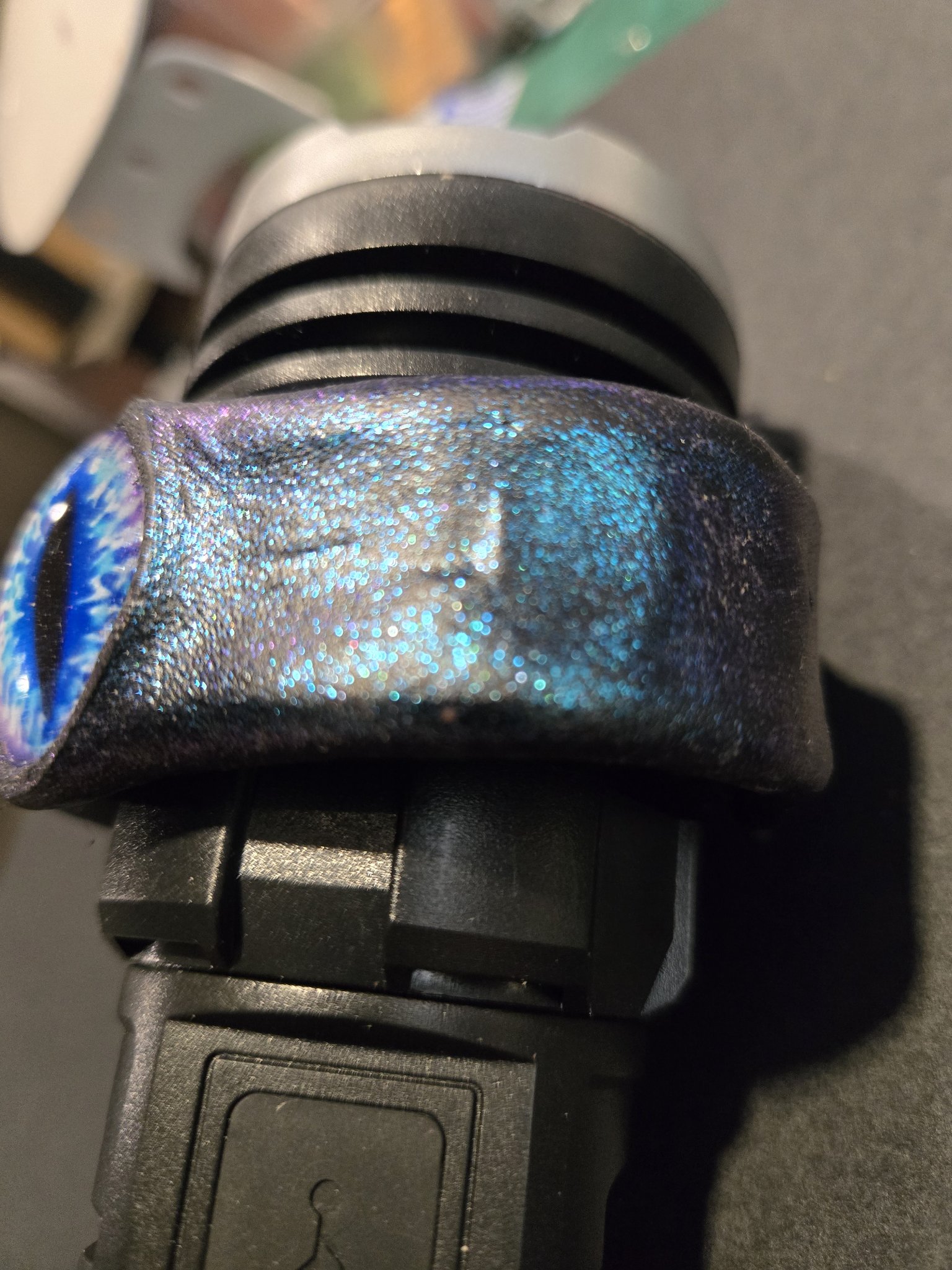 Close-up of the right side of stock 219 showing turquoise and blue sparkle