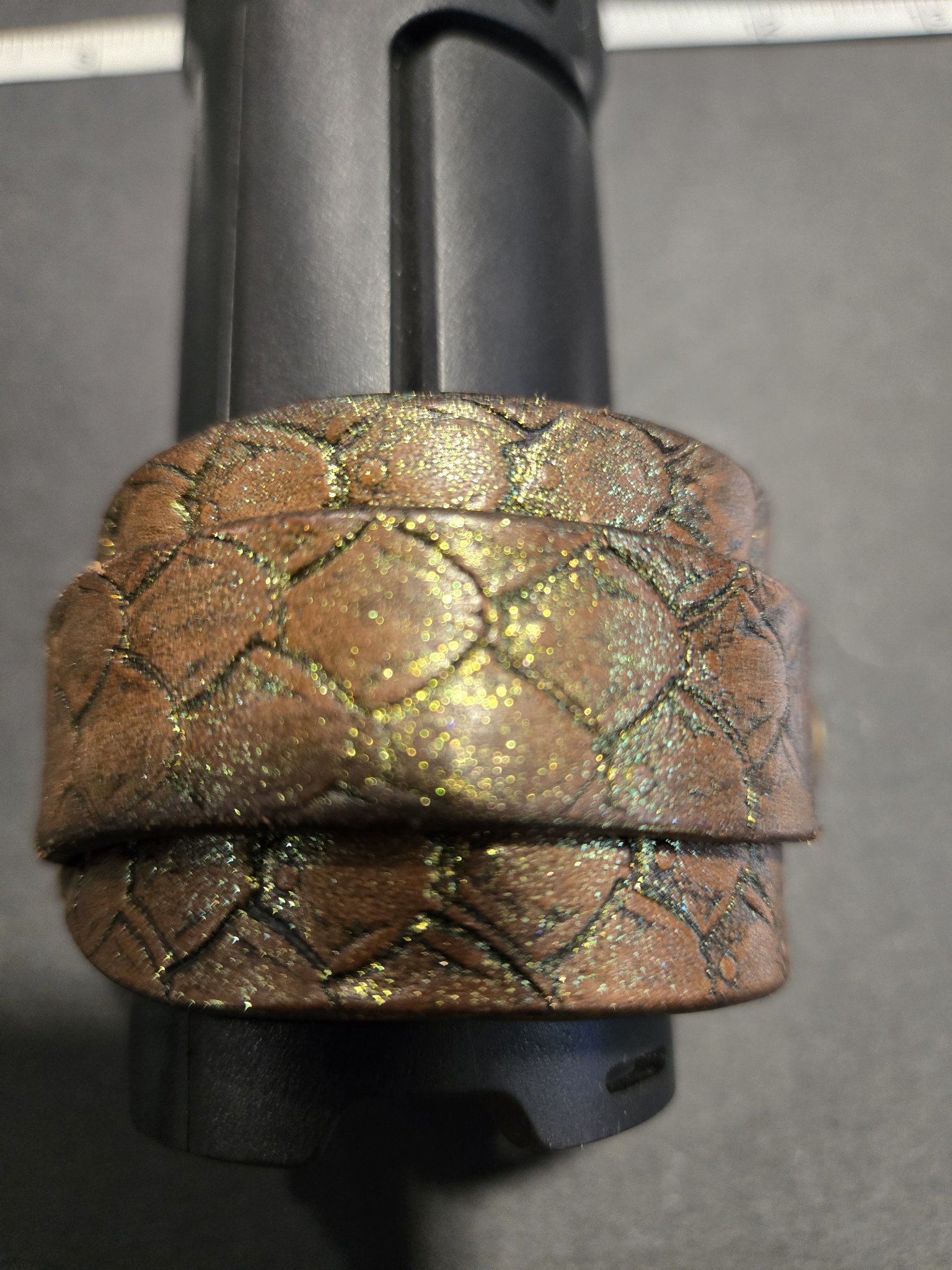 Stock 223 standing on display showing the hand-stamped dragon scale texture