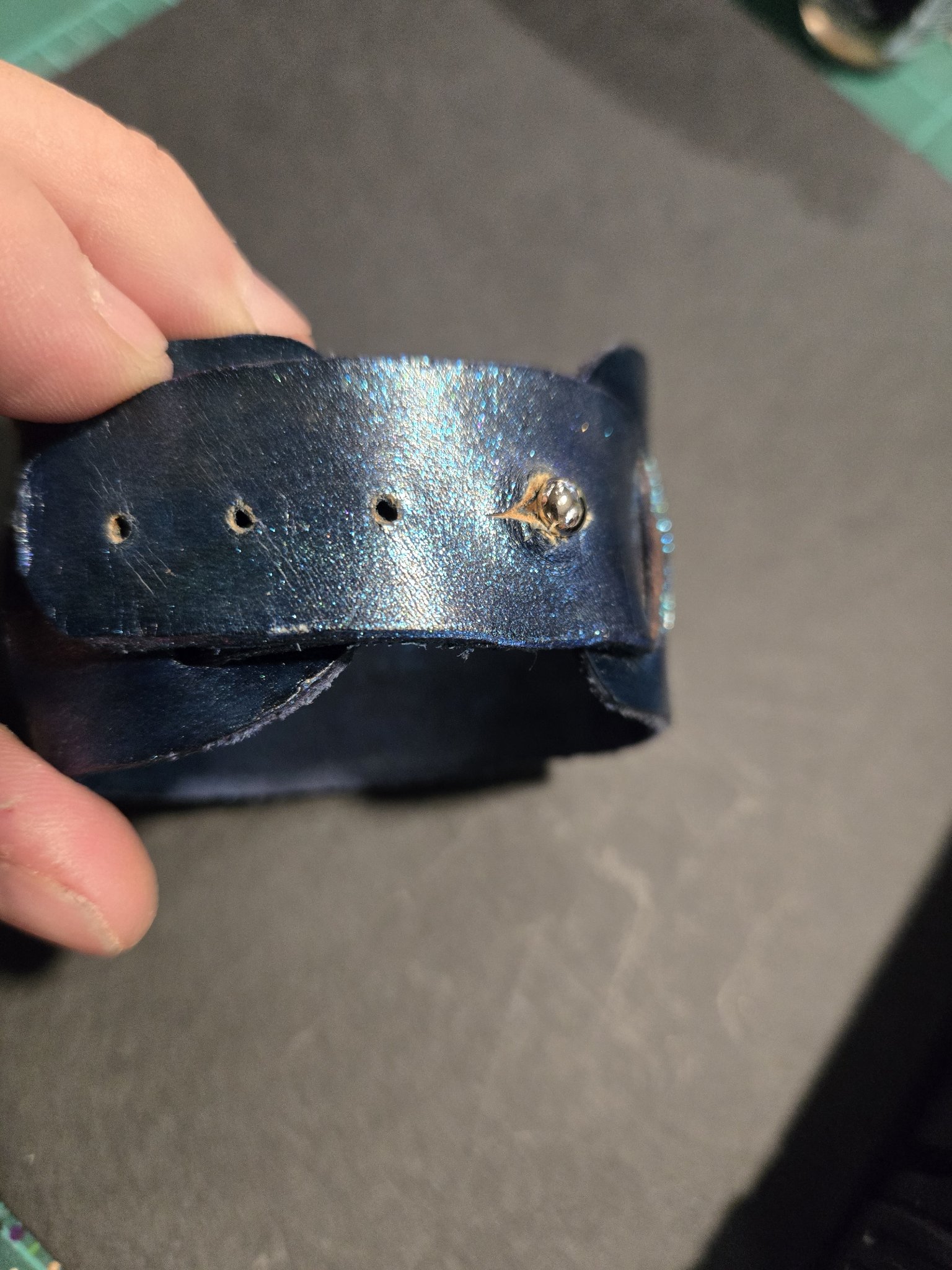 Close-up of stock 224 showing its button closure and adjustment holes