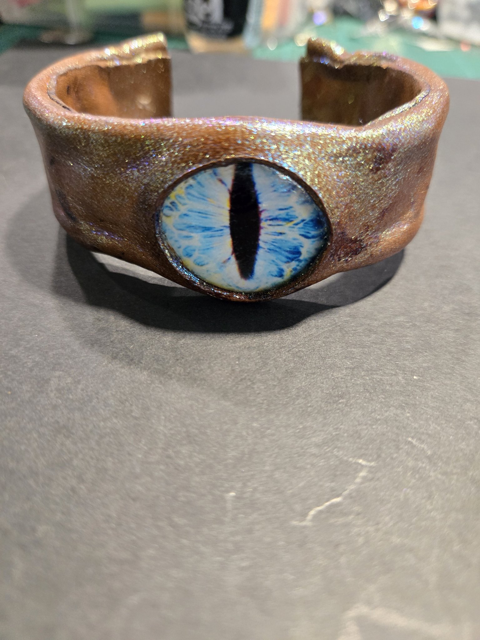 Stock 226 standing on display showing its blue dragon eye and open cuff shape