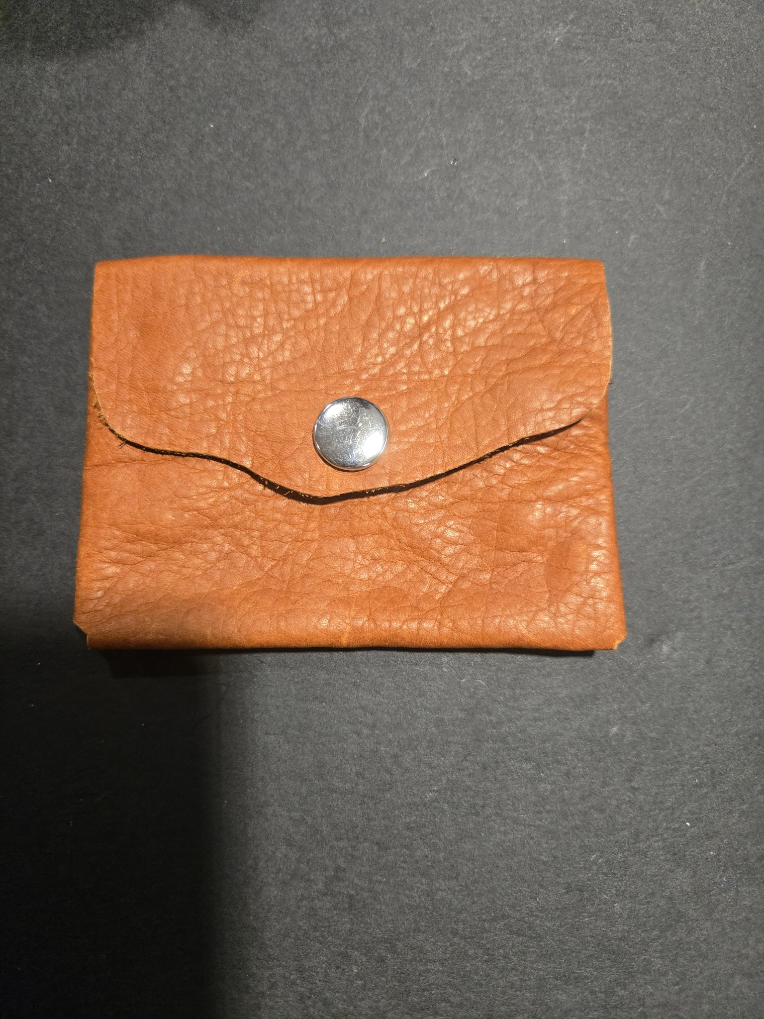 Stock 243 soft elk hide leather card and money holder closed, showing the envelope-style flap and silver-tone snap closure